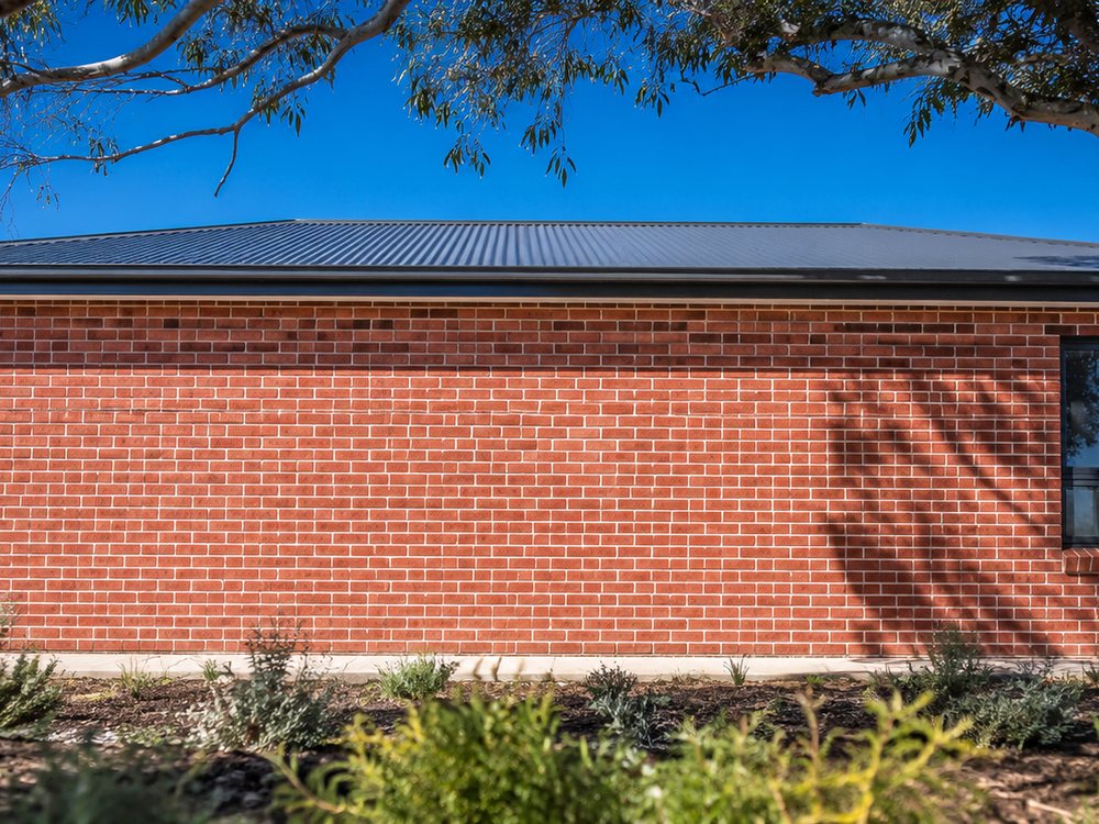 Completed red brick home built by Brick it On!