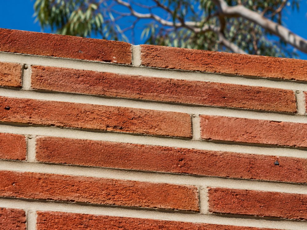 Close view of clean mortar joints in red brickwork